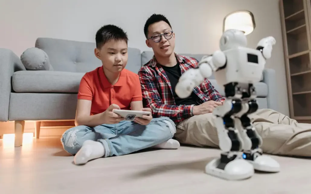 Father and child playing with electronic toys